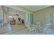 Screened patio with seating area and view of living room at 12327 Thornhill Ct, Lakewood Ranch, FL 34202