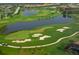 Aerial view of a golf course with lakes and residential area at 12327 Thornhill Ct, Lakewood Ranch, FL 34202