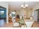Casual dining area with glass-top table and four chairs at 909 Barclay Ct, Venice, FL 34293