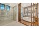 Spa-like bathroom with freestanding tub, glass shower, and modern fixtures at 1095 Blue Shell Loop, Sarasota, FL 34240