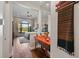 Hallway view of bedroom with wood floors and large window at 7045 Portmarnock Pl, Lakewood Ranch, FL 34202