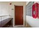 Condo entry door with adjacent wall and dark brown dresser at 9505 Amberdale Ct # 201, Riverview, FL 33578