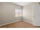 Bright bedroom with hardwood floors and window blinds at 9505 Amberdale Ct # 201, Riverview, FL 33578