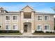 Tan two-story condo building with stairs and landscaping at 9505 Amberdale Ct # 201, Riverview, FL 33578