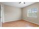 Well-lit bedroom featuring wood flooring and a window at 9505 Amberdale Ct # 201, Riverview, FL 33578