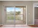 Spacious balcony with sliding glass doors and view of trees at 9505 Amberdale Ct # 201, Riverview, FL 33578