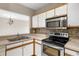 Efficient kitchen with stainless steel appliances and tile backsplash at 9505 Amberdale Ct # 201, Riverview, FL 33578