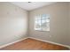Simple bedroom with hardwood floors and window with blinds at 9505 Amberdale Ct # 201, Riverview, FL 33578