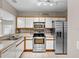 Kitchen with stainless steel appliances and light wood cabinets at 9505 Amberdale Ct # 201, Riverview, FL 33578