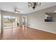Living room with light wood floors, open to kitchen and balcony at 9505 Amberdale Ct # 201, Riverview, FL 33578