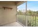 Screened balcony overlooks lush trees and landscape at 9505 Amberdale Ct # 201, Riverview, FL 33578