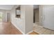 Bright entryway with wood flooring and access to kitchen and living areas at 9505 Amberdale Ct # 201, Riverview, FL 33578