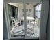Private balcony with table and chairs, overlooking water at 10469 Waterbird Way, Bradenton, FL 34209