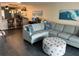 Open living space with a sectional sofa and a view of the kitchen at 10469 Waterbird Way, Bradenton, FL 34209