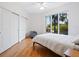 Comfortable bedroom with hardwood floors, ample closet space, and large windows at 340 S Palm Ave # 15, Sarasota, FL 34236