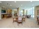 Spacious clubhouse with a bar, seating area, and large windows at 340 S Palm Ave # 15, Sarasota, FL 34236