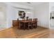 Elegant dining room with hardwood floors and modern light fixture at 340 S Palm Ave # 15, Sarasota, FL 34236
