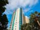 High-rise building with modern design, balconies, and palm trees at 340 S Palm Ave # 15, Sarasota, FL 34236