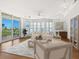 Bright living room with large windows, city views, and stylish furnishings at 340 S Palm Ave # 15, Sarasota, FL 34236