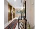 Elegant building lobby with brass elevators and ornate rug at 340 S Palm Ave # 15, Sarasota, FL 34236
