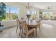 Elegant dining room with a wooden table and chairs, overlooking scenic views at 7820 34Th W Ave # 202, Bradenton, FL 34209