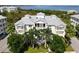 Luxury waterfront building with circular staircase and lush landscaping at 7820 34Th W Ave # 202, Bradenton, FL 34209