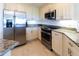Modern kitchen with stainless steel appliances and granite countertops at 7820 34Th W Ave # 202, Bradenton, FL 34209