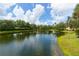 Serene community lake with lush landscaping at 7710 Lake Vista Ct # 404, Lakewood Ranch, FL 34202