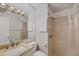 Clean bathroom with shower, vanity, and tiled walls at 6033 Arlene Way # 3, Bradenton, FL 34207