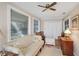 Sunroom features hardwood floors, seating, and built-in storage at 6033 Arlene Way # 3, Bradenton, FL 34207
