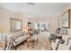 Living room features a light green sofa and ornate mirror at 6033 Arlene Way # 3, Bradenton, FL 34207