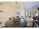 Small dining area with a dark wood table, view of living room and sliding doors at 26356 Nadir Rd # 101, Punta Gorda, FL 33983