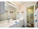 Double vanity bathroom with a large shower at 26356 Nadir Rd # 101, Punta Gorda, FL 33983