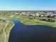 Aerial view showing community golf course and homes at 26356 Nadir Rd # 101, Punta Gorda, FL 33983