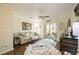 Comfortable living room with a beige sofa and access to a screened patio at 26356 Nadir Rd # 101, Punta Gorda, FL 33983