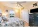 Cozy bedroom with a double bed, dresser, and large window at 26356 Nadir Rd # 101, Punta Gorda, FL 33983