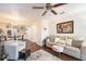 Spacious living room with a comfy couch and large window at 26356 Nadir Rd # 101, Punta Gorda, FL 33983