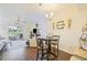 Cozy dining area with a round table and view into living room at 26356 Nadir Rd # 101, Punta Gorda, FL 33983