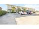 Exterior view of a townhome building with parking spaces in front at 26356 Nadir Rd # 101, Punta Gorda, FL 33983