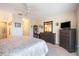 Spacious bedroom with dresser and ceiling fan at 26356 Nadir Rd # 101, Punta Gorda, FL 33983