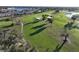 Aerial view of community golf course with walking path at 26356 Nadir Rd # 101, Punta Gorda, FL 33983