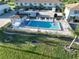 Community pool with lounge chairs and patio at 26356 Nadir Rd # 101, Punta Gorda, FL 33983
