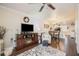 Open living room features a fireplace and built-in entertainment center at 26356 Nadir Rd # 101, Punta Gorda, FL 33983