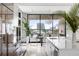 Modern kitchen with island, white cabinets, and water view at 509 Golden Gate Pt # 2, Sarasota, FL 34236