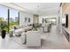 Open concept living area with city views and contemporary furniture at 509 Golden Gate Pt # 2, Sarasota, FL 34236