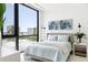 Light-filled bedroom with water views and comfortable bed at 509 Golden Gate Pt # 2, Sarasota, FL 34236