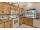 View of kitchen with ample counter space and stainless steel appliances at 328 Eden Dr, Englewood, FL 34223