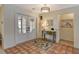 Bright entryway with tiled floor, console table, and view to the living room at 328 Eden Dr, Englewood, FL 34223