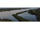 Aerial view of waterfront property with canal at 328 Eden Dr, Englewood, FL 34223
