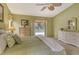 Bright bedroom with pool access and king-size bed at 328 Eden Dr, Englewood, FL 34223